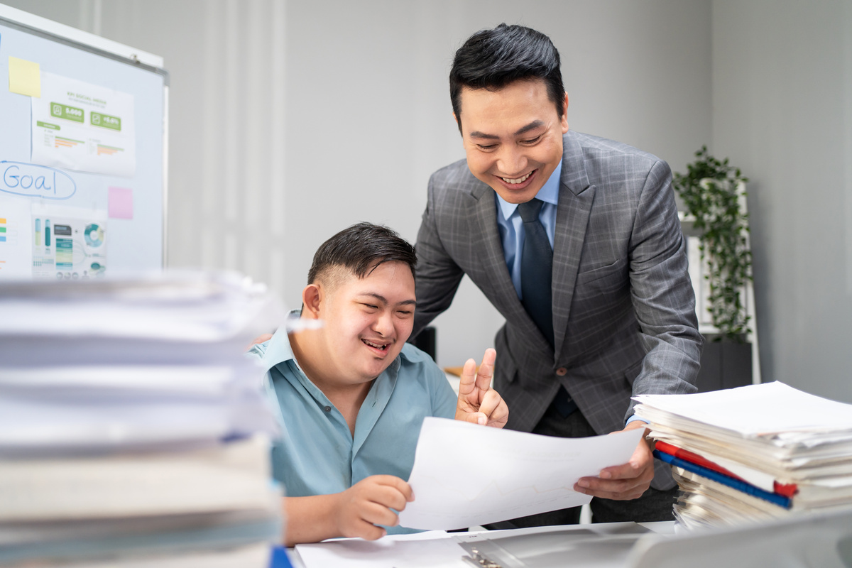 Employee with Disability Discussing Work with Manager